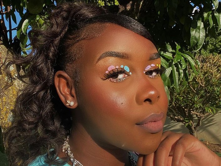 person wearing pastel egg-shaped eye makeup