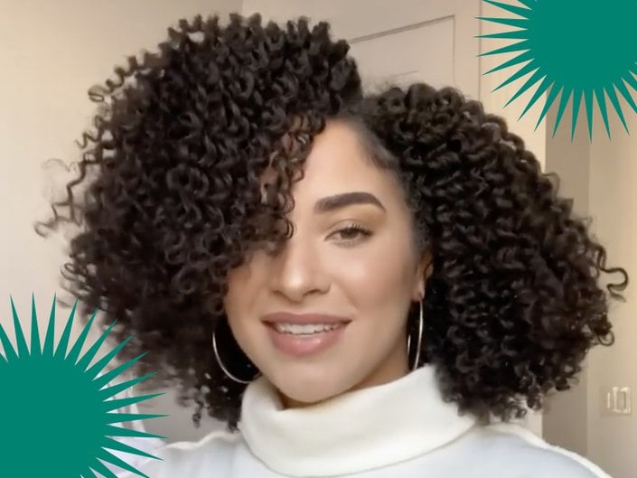 person with twist out hairstyle