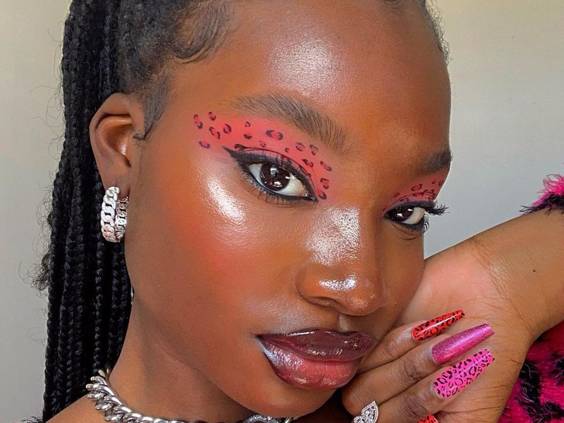 person wearing pink leopard-print eye makeup