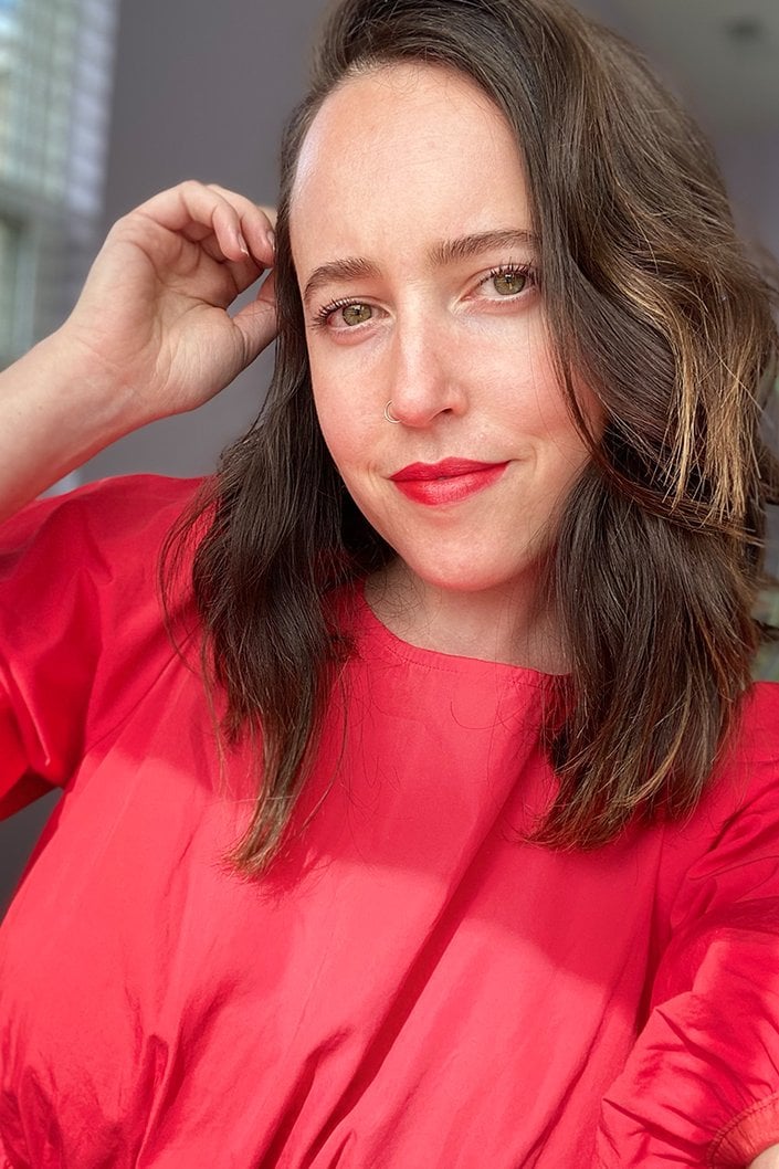 person wearing Lancôme L’Absolu Rouge Drama Ink Liquid Lipstick in Dis Oui