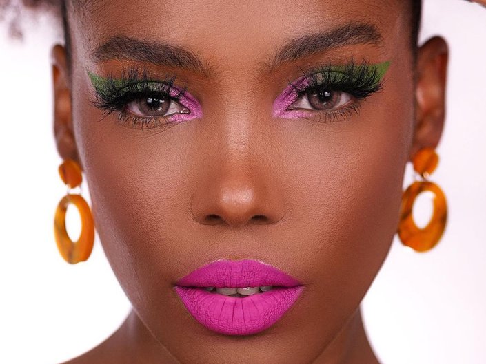 person wearing statement eye and lip makeup