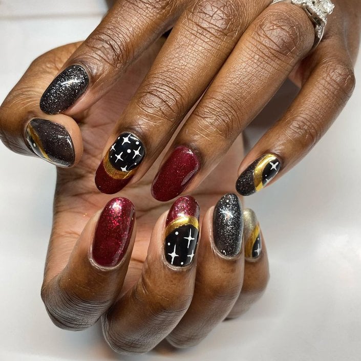 hands with colorful nail art on nails