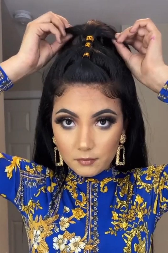 person wearing half up half down hairstyle