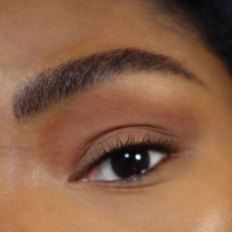 close up on eye wearing brown eyeshadow