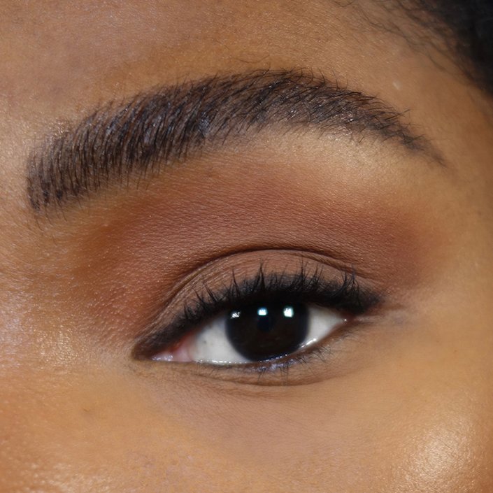 close up on eye with black eyeliner on upper lash line