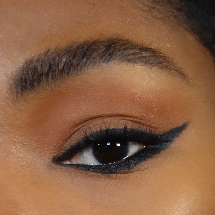 close up on eye with reverse cat eye makeup