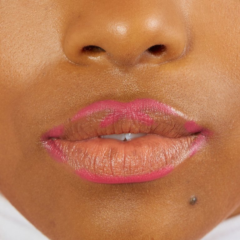 lips outlined with pink lip liner