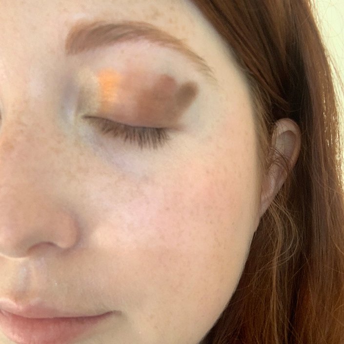 person wearing eyeshadow swatches on eyelid