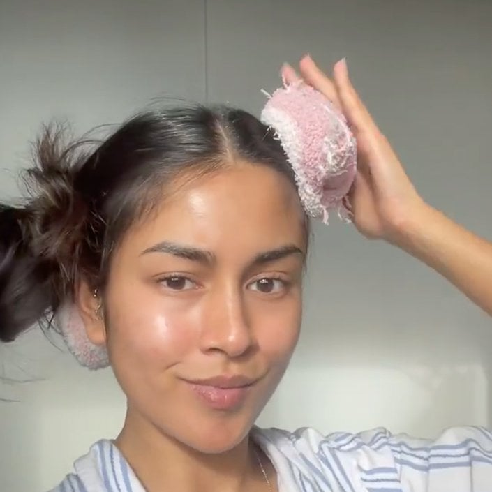 person styling hair with socks