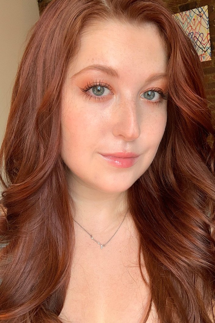 person wearing peachy shimmery eyeshadow