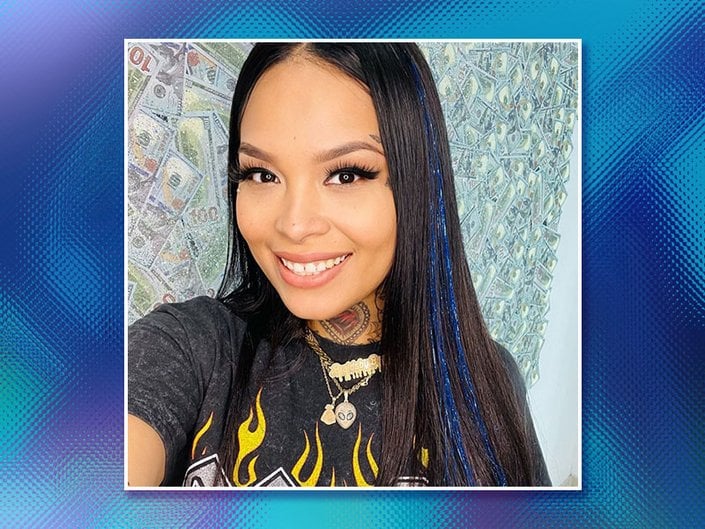 Picture of a person with black hair and hair tinsel on a graphic blue background