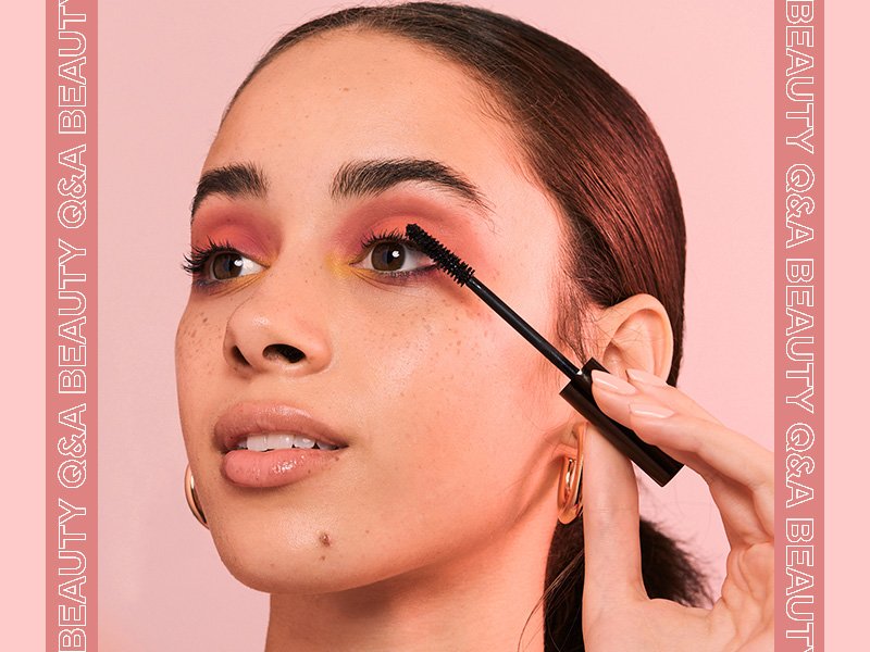 woman applying mascara vertically