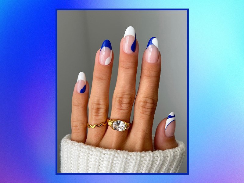 Blue nail art on graphic blue background 