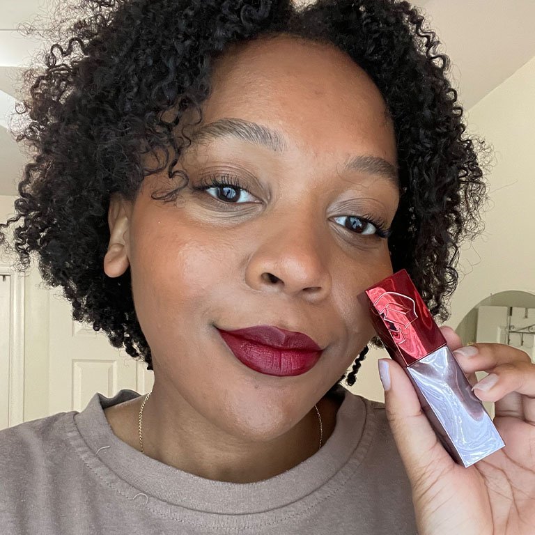 Kat wears and holds up the Urban Decay Vice Lip Bond Glossy Liquid Lipstick in Raw Footage 