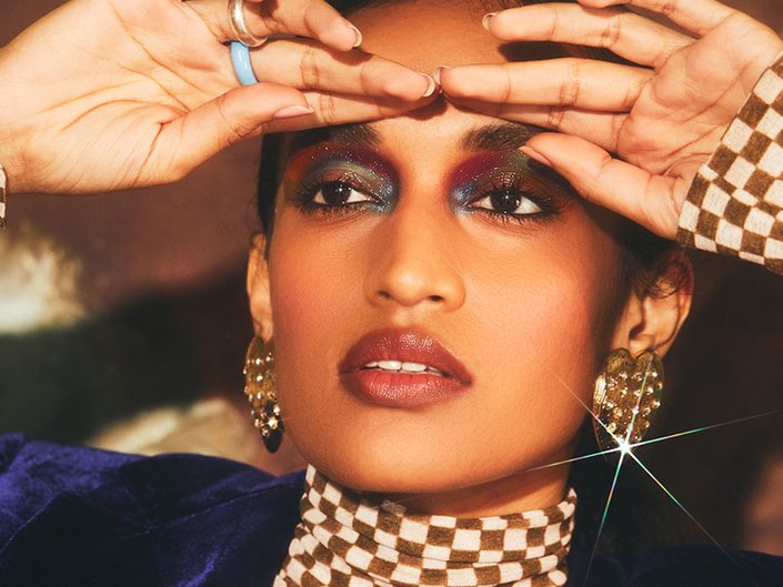 person wearing multicolored glitter eyeshadow
