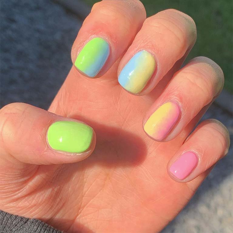 hand with colorful neon ombre nails