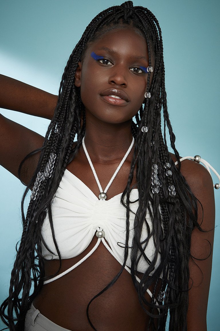 Person wearing braids with beads