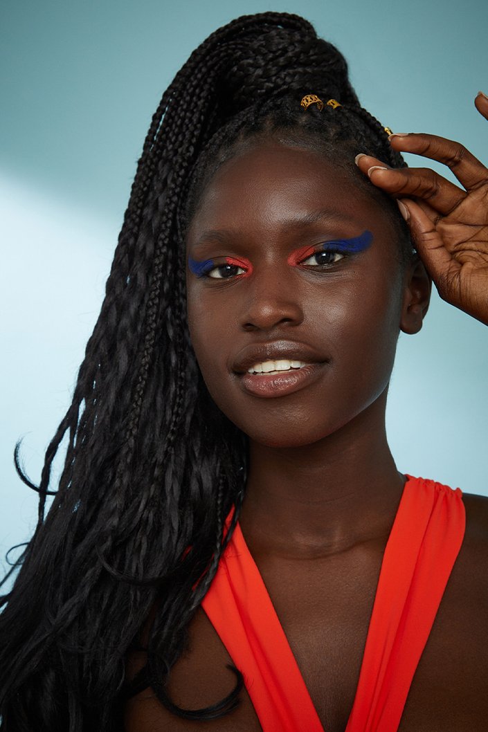 Person with box braids in a ponytail