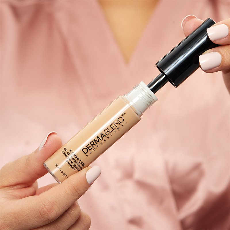 Person holding Dermablend Cover Care Full Coverage Concealer