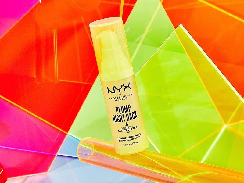 NYX Professional Makeup Plump Right Back Primer and Serum photographed onto a bright neon yellow, orange and pink background