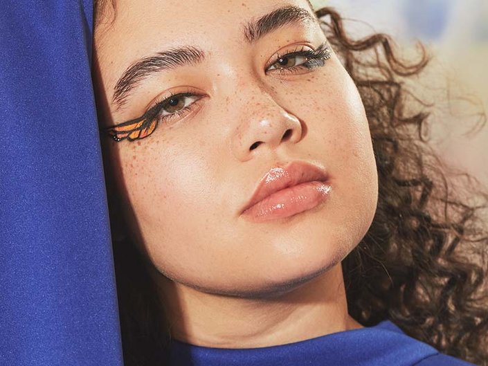 person with butterfly eyeliner makeup