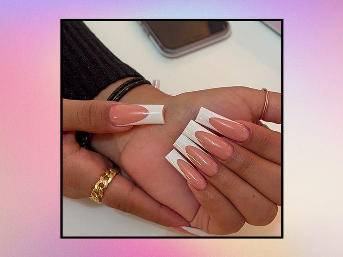 manicured acrylic coffin nails on pink background