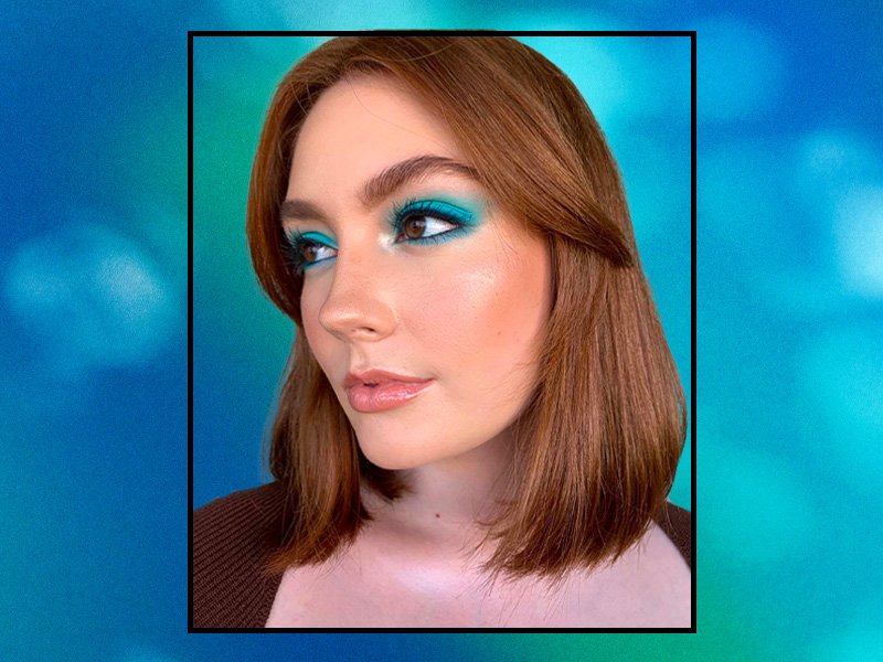Person wearing a bright blue monochromatic eyeshadow look, where the blue eyeshadow is applied all over the eyelid and along the lower lash line.