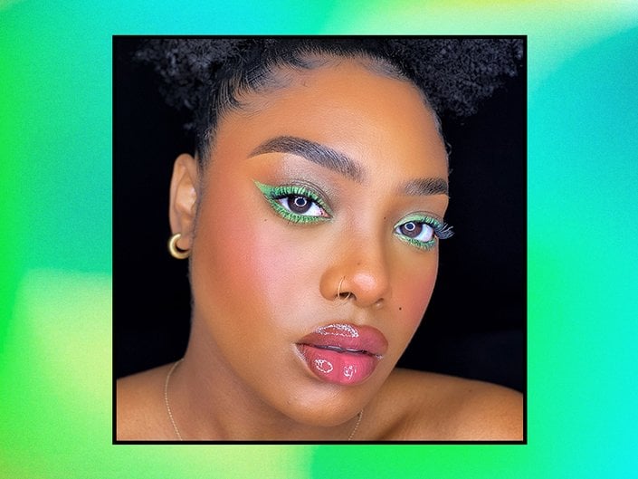 person looking into the camera wearing neon eyeliner
