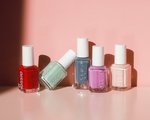 Picture of multiple Essie nail polishes on a light pink background