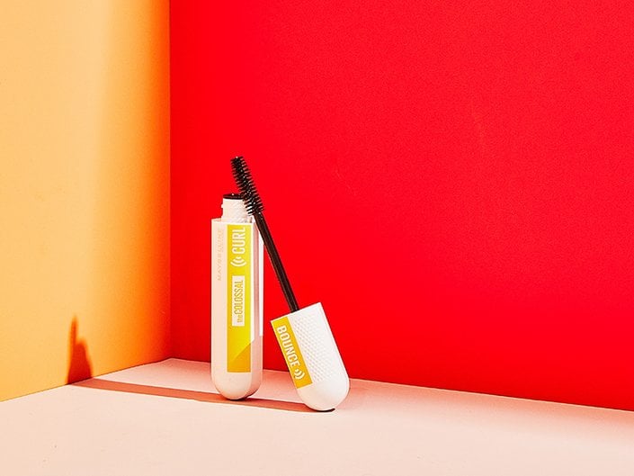 Maybelline New York The Colossal Curl Bounce Mascara on a red background