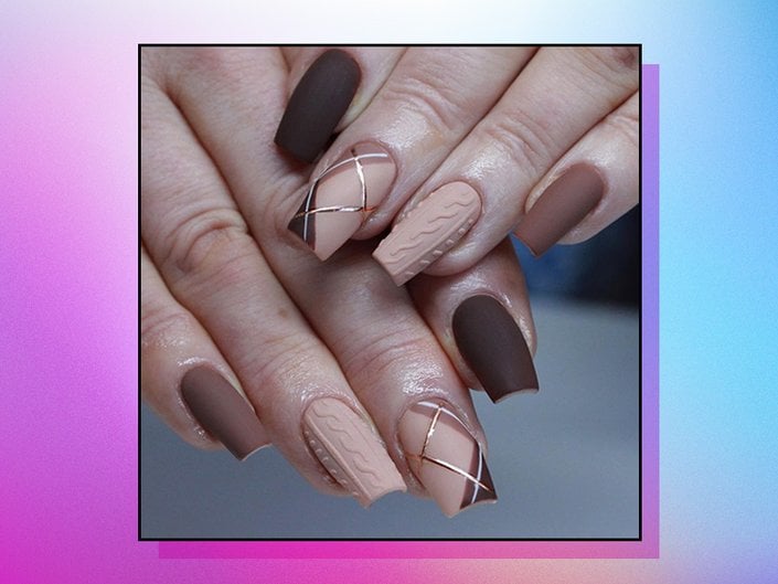 one hand resting on top of another with a brown and tan plaid manicure with cable knit accent nails