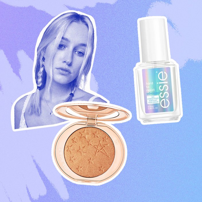 charlotte tilbury highlighter, essie topcoat collaged onto a blue background with a photo of jordan