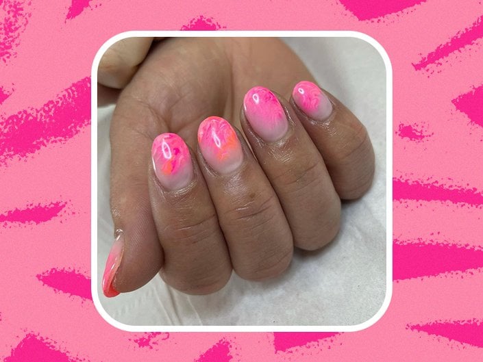 A hand with pink and orange blooming gel nail polish collaged on a pink animal print background