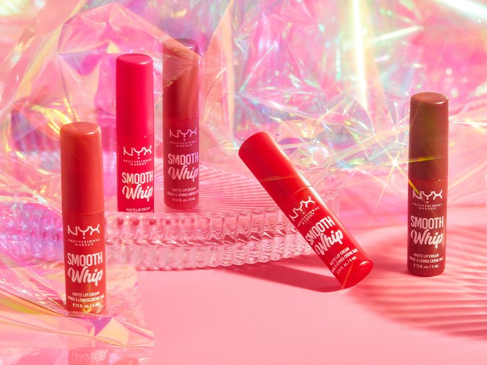 nyx matte lipsticks photographed on a bright pink prismatic background