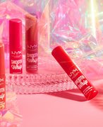 nyx matte lipsticks photographed on a bright pink prismatic background