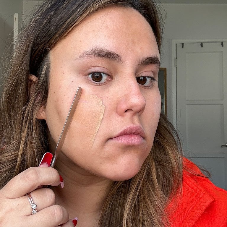 Picture of a woman applying foundation with a spatula