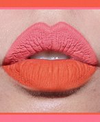Close-up photo of a two-toned lipstick, with the top lip a coral pink matte shade and the bottom lip a bright orange-red matte shade, collaged on a pink and orange background