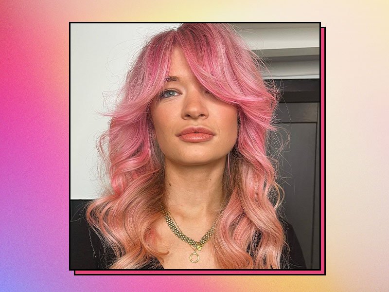 A pink, orange and yellow gradient background with a picture of a person with pink wavy hair.