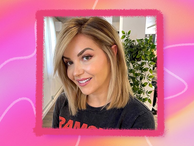 person looking into the camera smiling with side bangs collaged onto a hot pink background