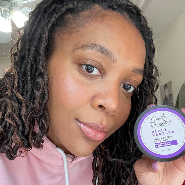 Selfie of an editor holding the Carol’s Daughter Black Vanilla Edge Control Smoother