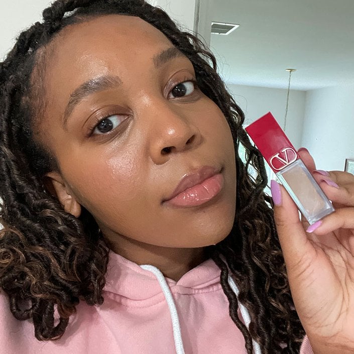 kat wearing and holding the valentino beauty concealer