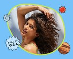Photo of person with dark curly hair on a blue background with the “Beauty Q&A” logo 