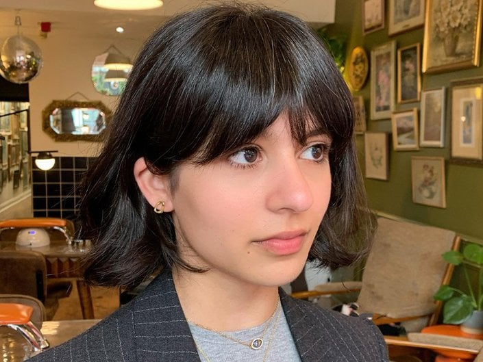 person sporting french bangs