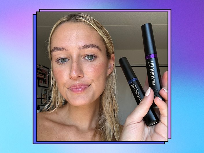 Photo of the editor wearing and holding up the L’Oréal Paris Telescopic Lift Washable Color Mascara in shades Galactic Purple and Stellar Blue, collaged on a blue and purple background.