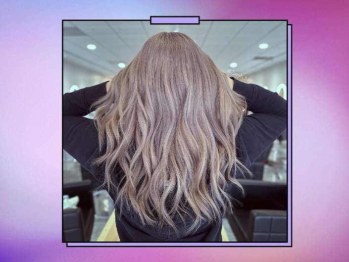 Picture of the back of a person’s head with milk tea hair, on a graphic purple background