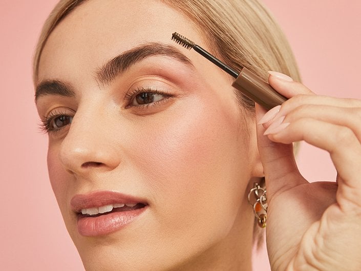 Picture of someone applying eyebrow gel