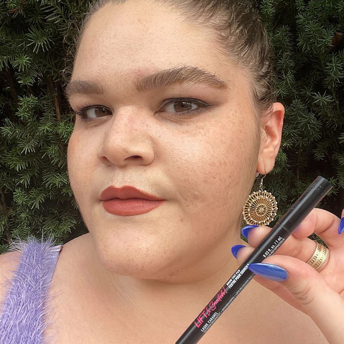 alexis holding the NYX Professional Makeup Lift & Snatch Brow Tint Pen