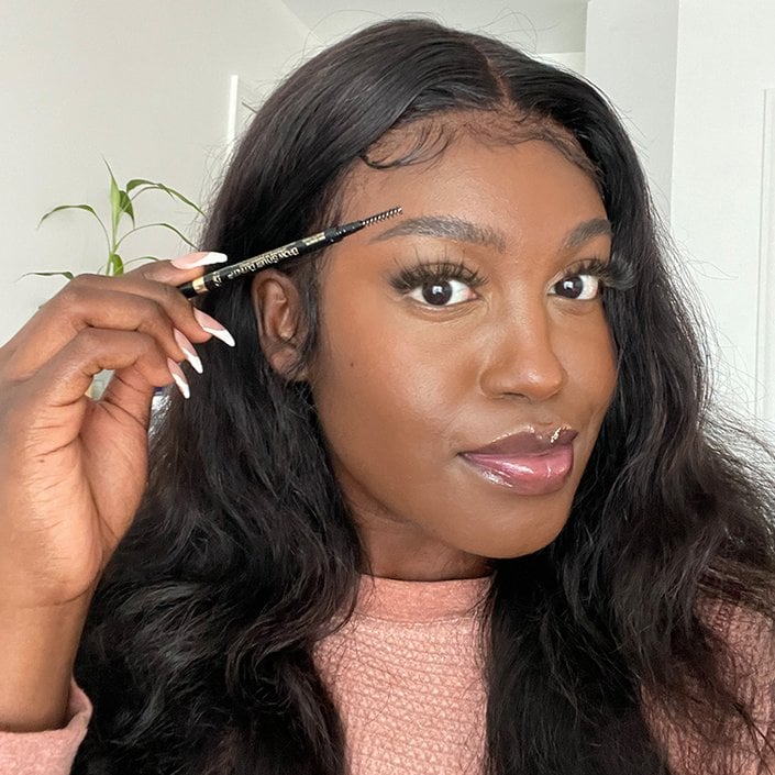 sarah holding the L'Oréal Paris Brow Stylist Definer Mechanical Waterproof Eyebrow Pencil in Dark Brunette