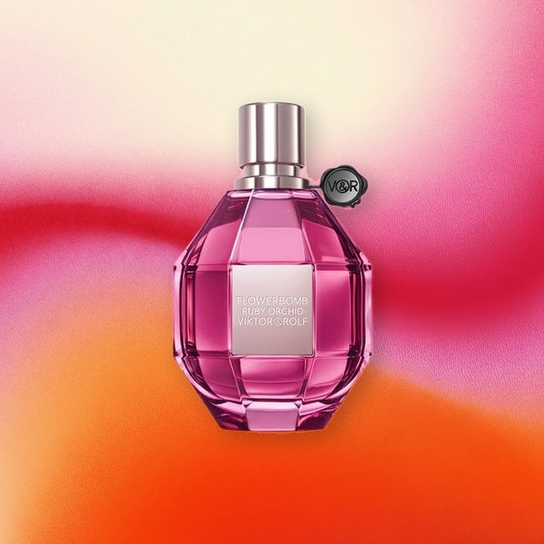 Viktor & Rolf Flowerbomb Ruby Orchid Eau de Parfum o a pink textured background