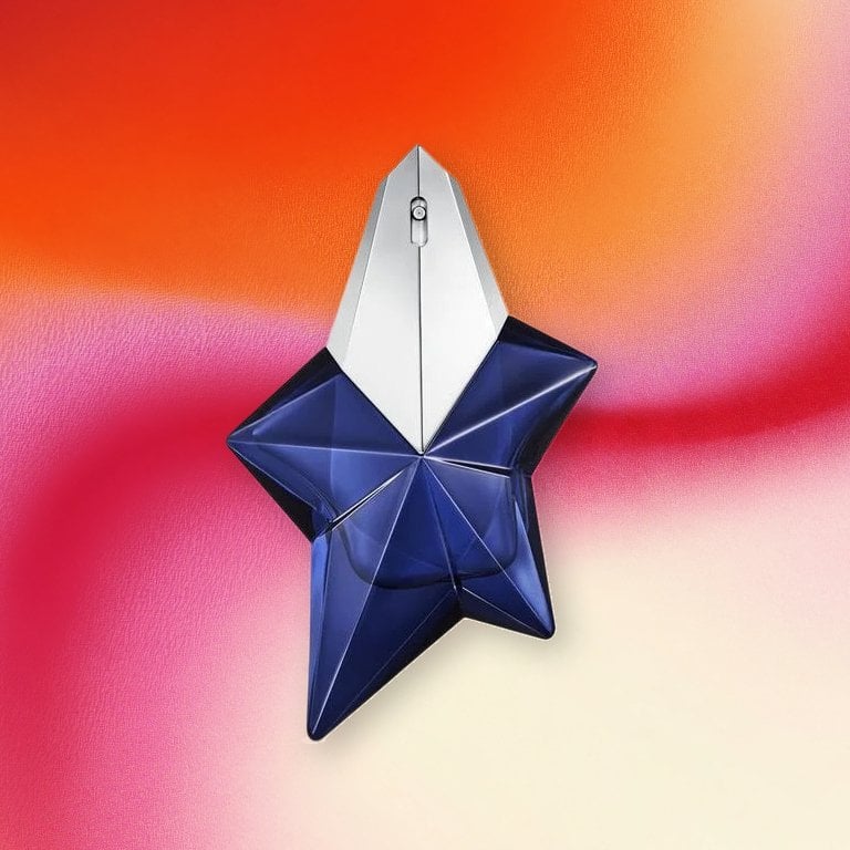 Mugler Angel Elixir Eau de Parfum on a pink textured background